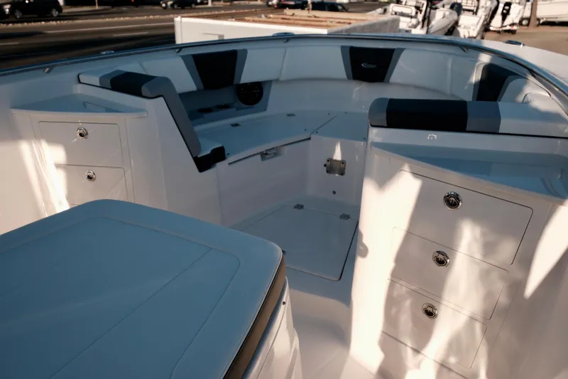 Slide: The Image of 2024 Robalo R360 Center Console boat interior with seating and storage compartments. - 39