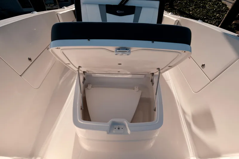 Slide: The Image of 2024 Robalo R360 Center Console boat with open storage compartment. - 41