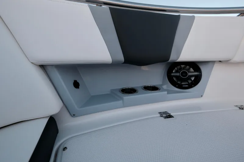 Slide: The Image of 2024 Robalo R360 Center Console interior with cup holders and speaker. - 42