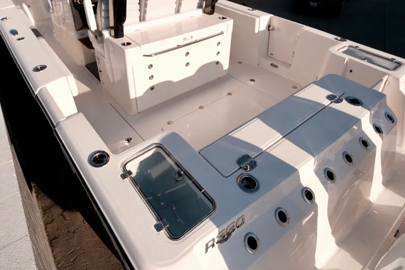 Slide: The Image of 2024 Robalo R360 Center Console boat interior with seating and storage features. - 6