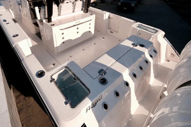 Slide: The Image of 2024 Robalo R360 Center Console boat interior with seating and storage compartments. - 7