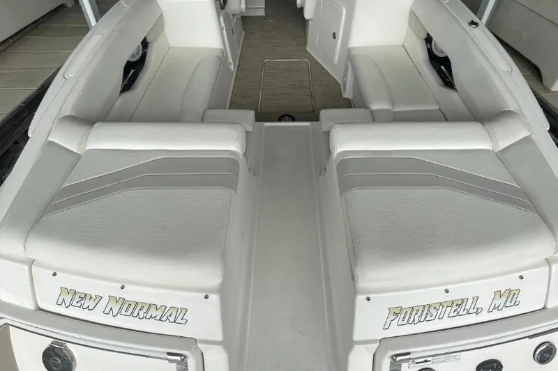 Slide: The Image of 2008 Regal 2700 Bowrider boat interior with white seating, labeled "New Normal" and "Foristell, MO". - 9