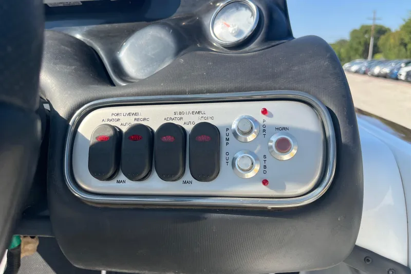 Slide: The Image of 2015 Nitro Z-8 boat dashboard and seating area under clear blue sky. - 19