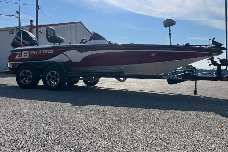 Slide: The Image of 2015 Nitro Z-8 boat with Mercury Pro XS engine on trailer, parked outdoors. - 21