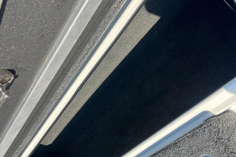 Slide: The Image of 2015 Nitro Z-8 boat deck with carpeted surface in a parking lot. - 30