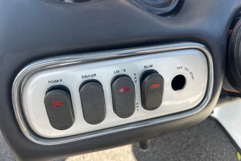 Slide: The Image of Storage compartment of a 2015 Nitro Z-8 boat, featuring a drain plug. - 36
