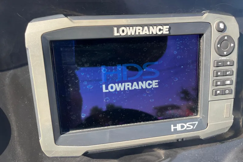 Slide: The Image of Interior view of a 2015 Nitro Z-8 boat, featuring carpeted flooring and metal trim. - 38