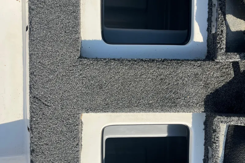 Slide: The Image of Storage compartment of a 2015 Nitro Z-8 boat with carpeted interior. - 39