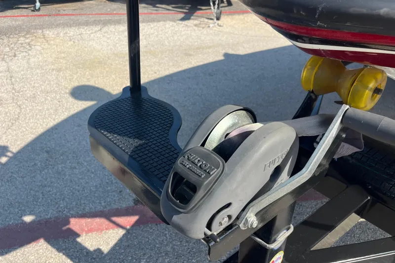 Slide: The Image of 2015 Nitro Z-8 boat on trailer by lake, under blue sky with clouds. - 4