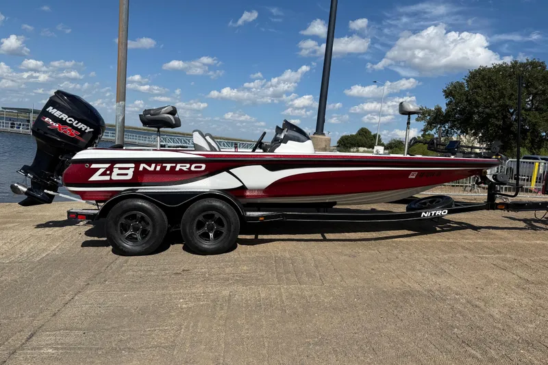 Slide: The Image of 2015 Nitro Z-8 boat with Mercury engine on trailer by the water. - 48