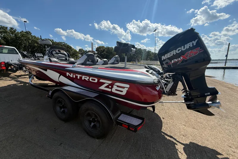 Slide: The Image of Red 2015 Nitro Z-8 boat with Mercury Pro XS engine on a trailer. - 61