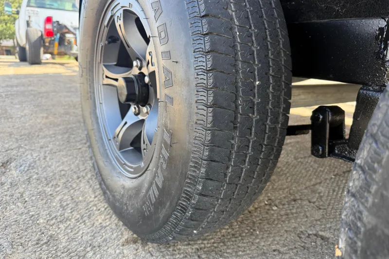 Slide: The Image of Close-up of 2015 Nitro Z-8 tire on textured pavement. - 63