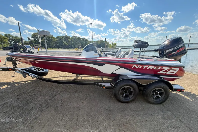 Slide: The Image of Close-up of a 2015 Nitro Z-8 tire and wheel on a paved surface. - 64