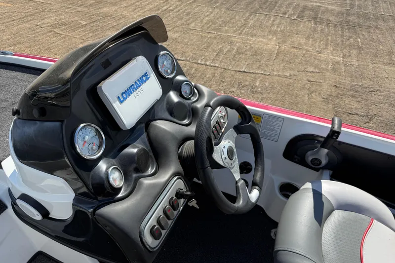 Slide: The Image of Control panel of a 2015 Nitro Z-8 boat with switches and buttons. - 77