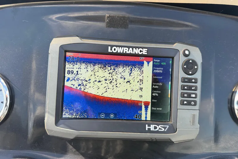 Slide: The Image of Lowrance fishfinder display on a 2015 Nitro Z-8 boat, showing sonar readings. - 85