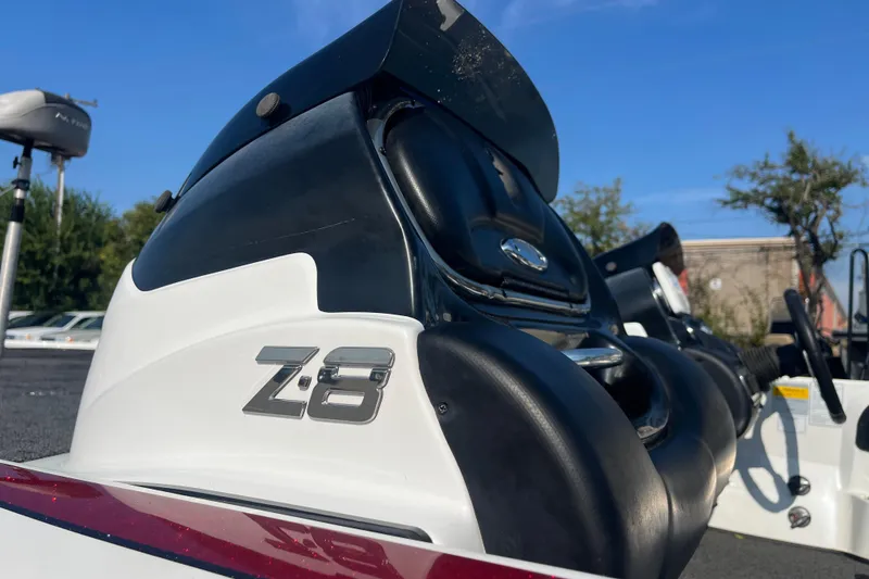 Slide: The Image of Trailer hitch of a 2015 Nitro Z-8 boat, parked on asphalt. - 9