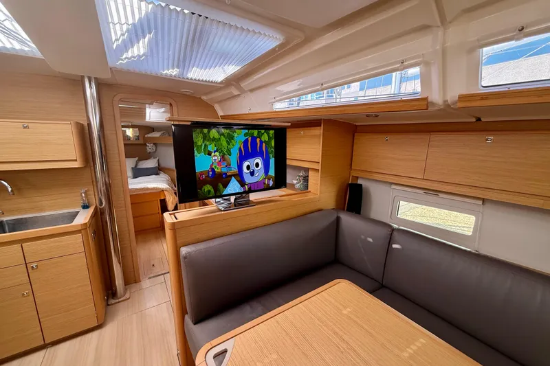 Slide: The Image of Luxurious interior of 2020 Dufour 430 yacht with modern kitchen and seating area. - 15
