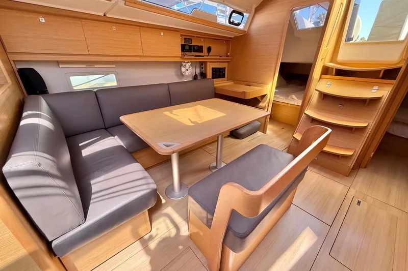 Slide: The Image of Interior of 2020 Dufour 430 yacht with modern kitchen and cozy seating area. - 17