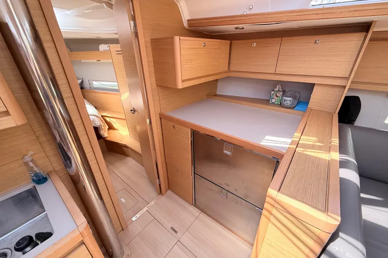 Slide: The Image of Interior of 2020 Dufour 430 yacht with modern seating and wooden finishes. - 19