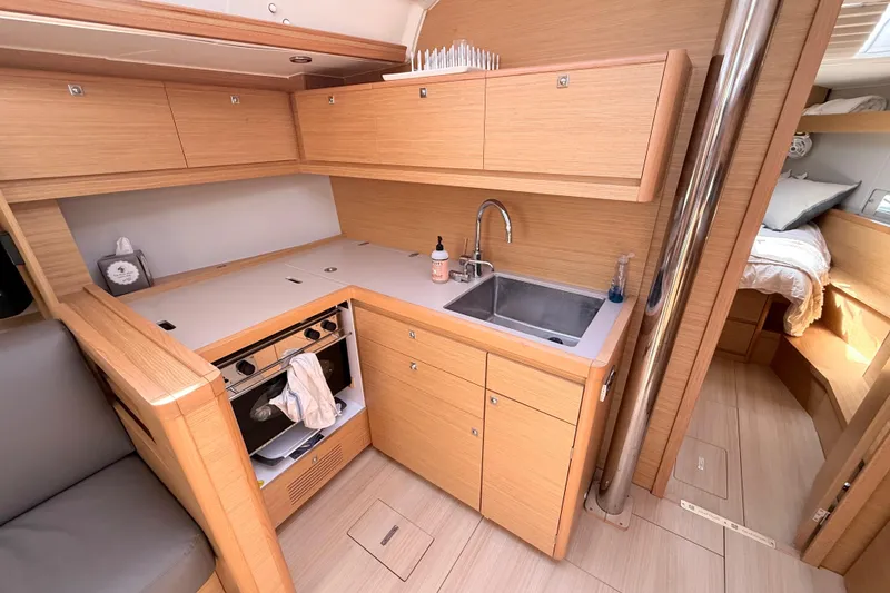 Slide: The Image of Modern interior of 2020 Dufour 430 yacht with wood finish and cozy seating area. - 20
