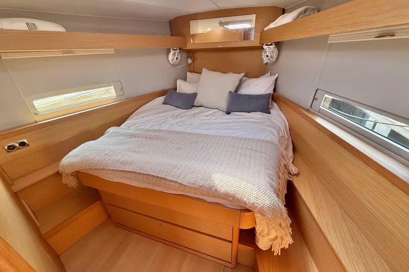 Slide: The Image of Modern interior of 2020 Dufour 430 yacht with dining area and wooden cabinetry. - 25