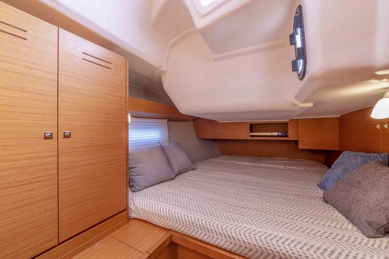 Slide: The Image of Cozy cabin interior of 2020 Dufour 430 yacht with comfortable bedding. - 27