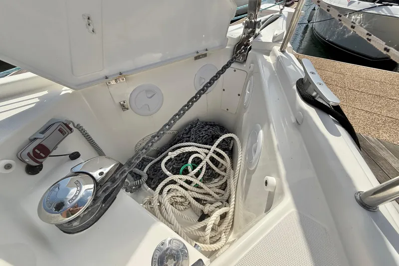 Slide: The Image of Dufour 430 sailboat deck with inflatable dinghy, 2020 model, docked at marina. - 32