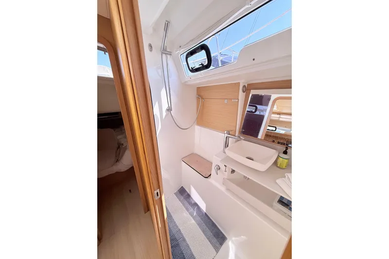 Slide: The Image of Open storage compartment on 2020 Dufour 430 yacht with ice and carton inside. - 36