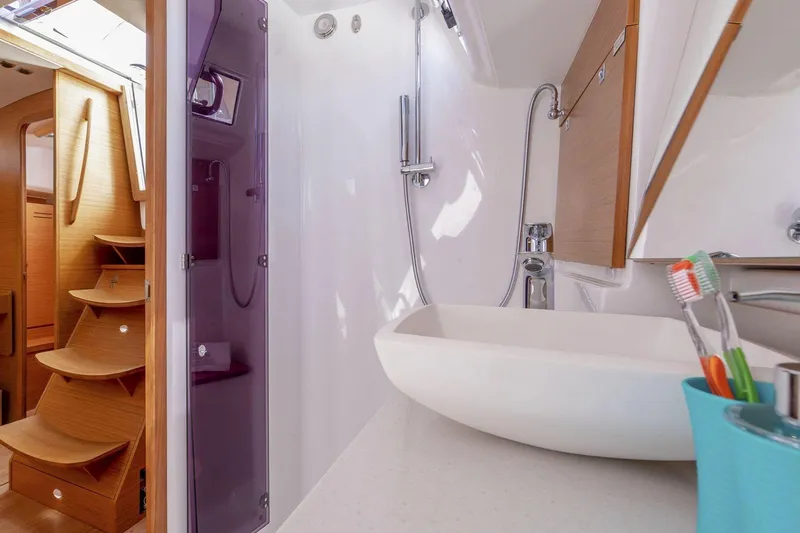 Slide: The Image of Modern kitchen stove on 2020 Dufour 430 yacht, featuring a sleek stainless steel design. - 37