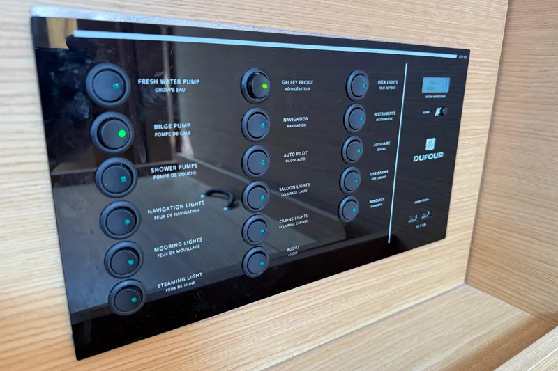 Slide: The Image of Control panel on 2020 Dufour 430 yacht with Xantrex, Raymarine, and Fusion systems. - 41