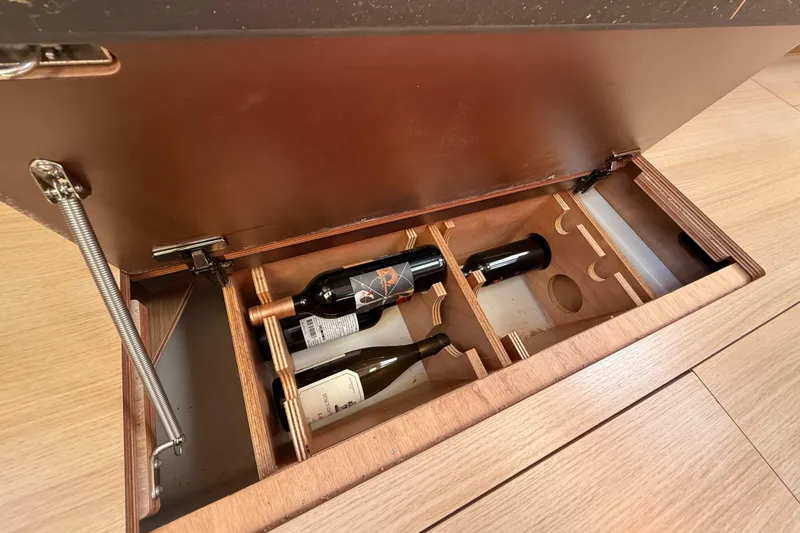 Slide: The Image of Remote control for Dufour 430 yacht, 2020 model, on wooden surface. - 42