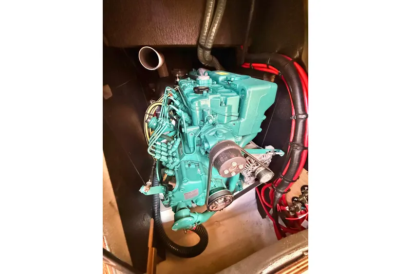 Slide: The Image of Wine storage compartment on 2020 Dufour 430 yacht, featuring wooden dividers and bottles. - 44