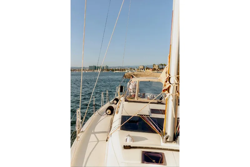 Slide: The Image of Engine compartment of a 2020 Dufour 430 sailboat, featuring a teal marine engine. - 46