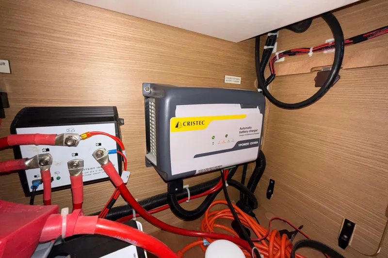 Slide: The Image of 2020 Dufour 430 sailboat cruising near a coastal city skyline. - 48