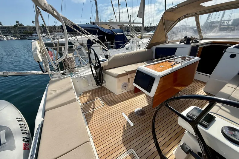 Slide: The Image of 2020 Dufour 430 sailboat docked at marina under clear blue sky. - 6