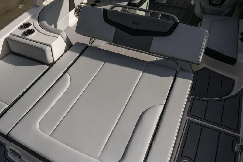 Slide: The Image of 2025 Chaparral 247 SSX boat interior with luxurious seating and cup holders. - 10
