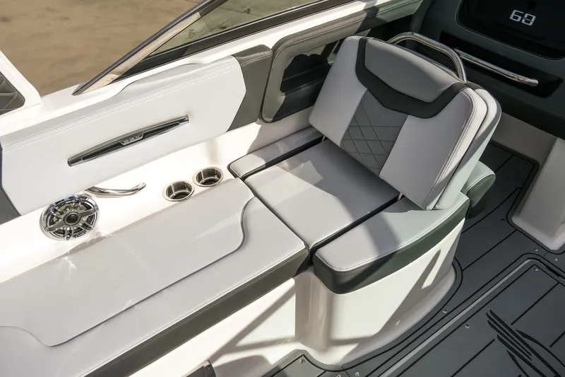 Slide: The Image of 2025 Chaparral 247 SSX boat interior with stylish seating and cup holders. - 13