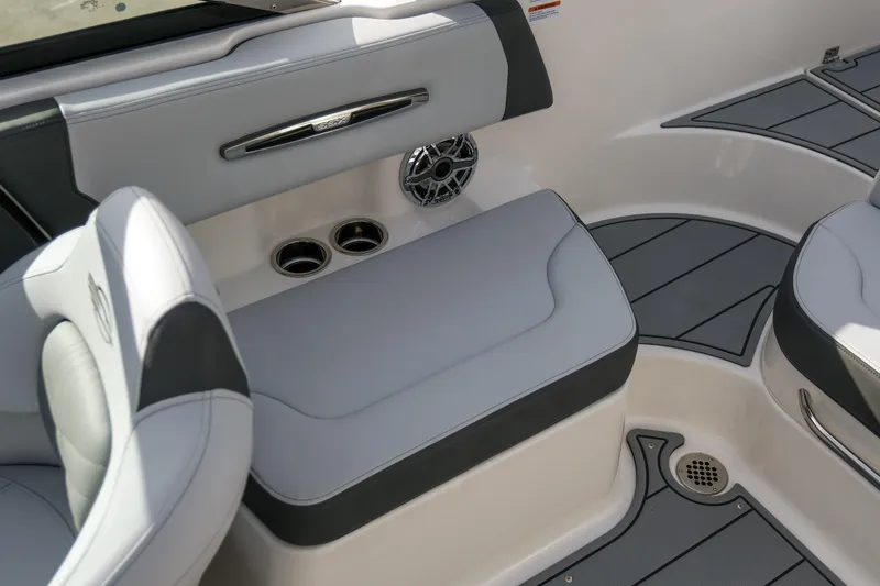 Slide: The Image of 2025 Chaparral 247 SSX boat interior with gray seating and cup holders. - 16