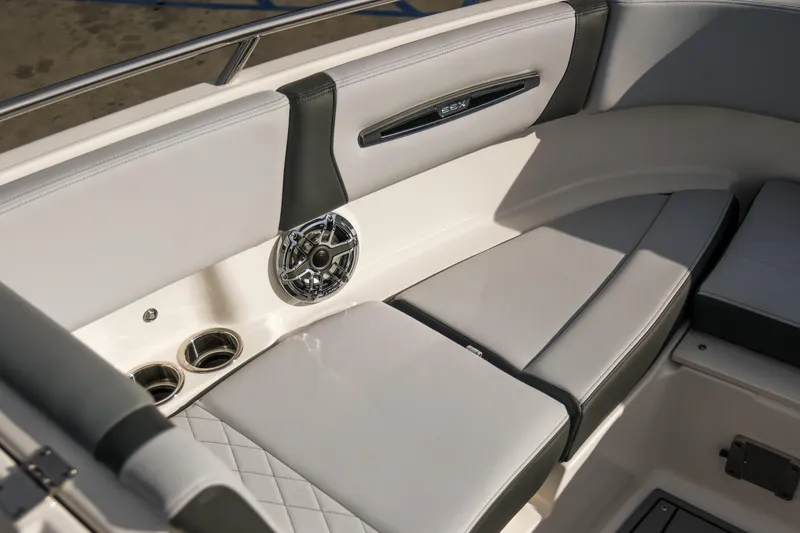 Slide: The Image of 2025 Chaparral 247 SSX boat interior with luxurious seating and speaker system. - 18