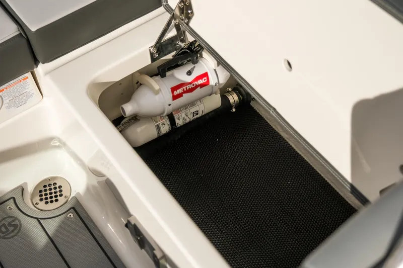 Slide: The Image of Storage compartment in 2025 Chaparral 247 SSX boat with fire extinguisher. - 20