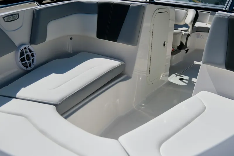 Slide: The Image of Interior of 2025 Chaparral 23 SSi boat with white seating and speaker. - 11