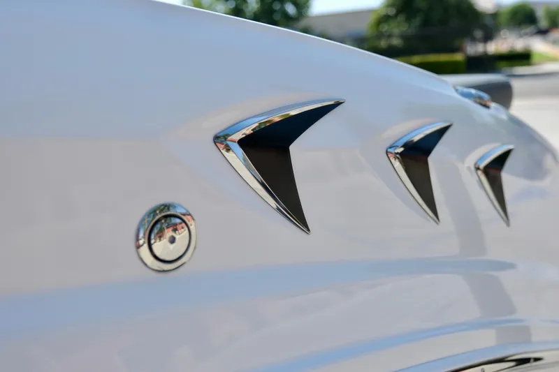 Slide: The Image of 2025 Chaparral 23 SSi boat detail with sleek chrome accents and modern design elements. - 12