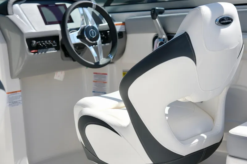 Slide: The Image of 2025 Chaparral 23 SSi boat interior with steering wheel and modern seating. - 14