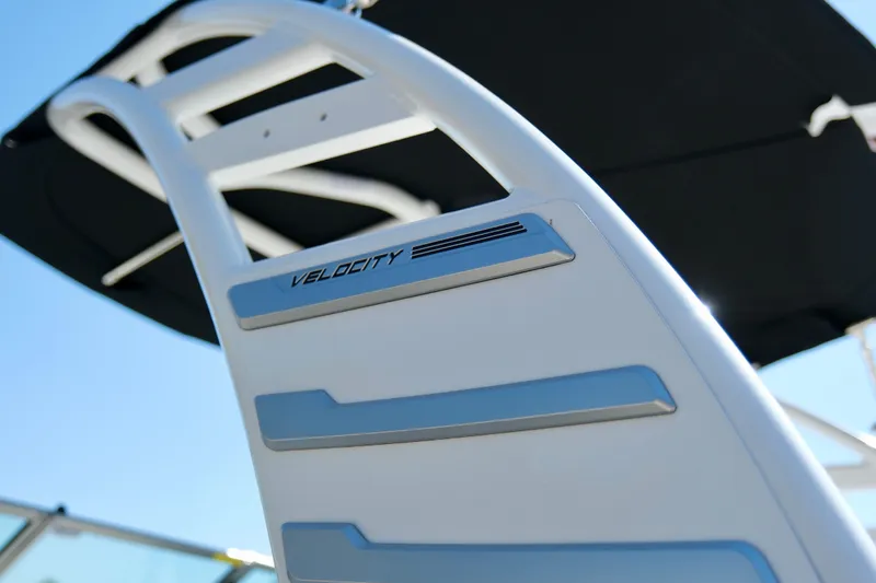 Slide: The Image of 2025 Chaparral 23 SSi boat with sleek design and "Velocity" branding detail. - 16