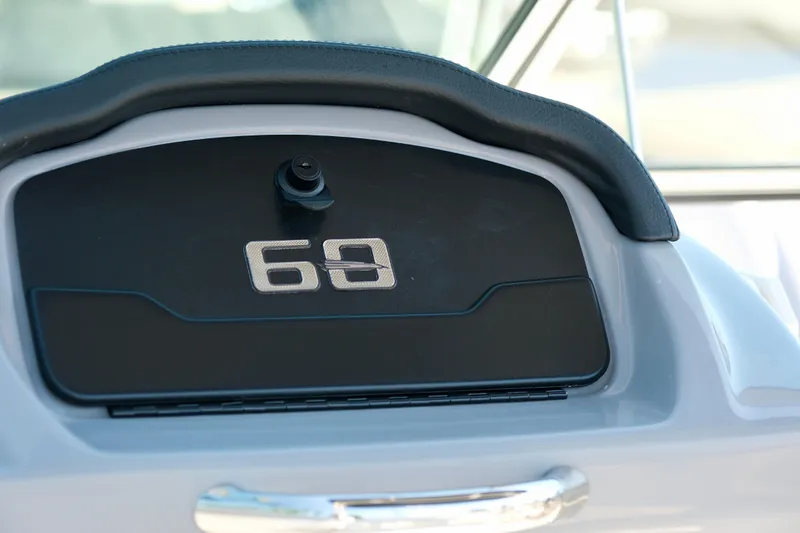 Slide: The Image of Dashboard of 2025 Chaparral 23 SSi boat with number 69 displayed. - 17