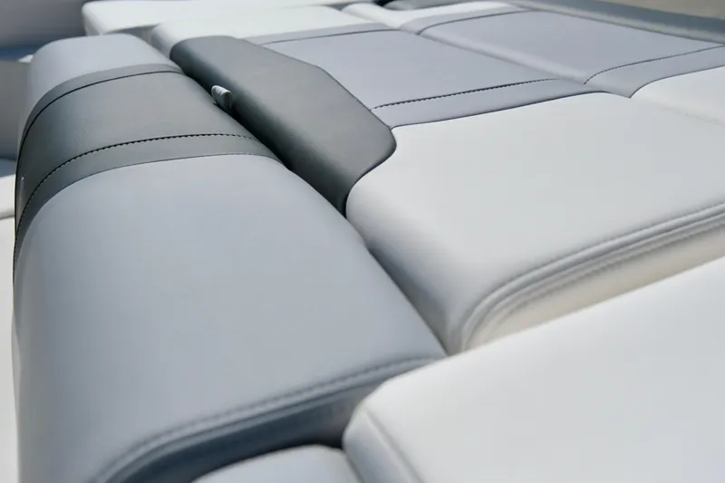 Slide: The Image of 2025 Chaparral 23 SSi boat interior with sleek, modern upholstery design. - 19