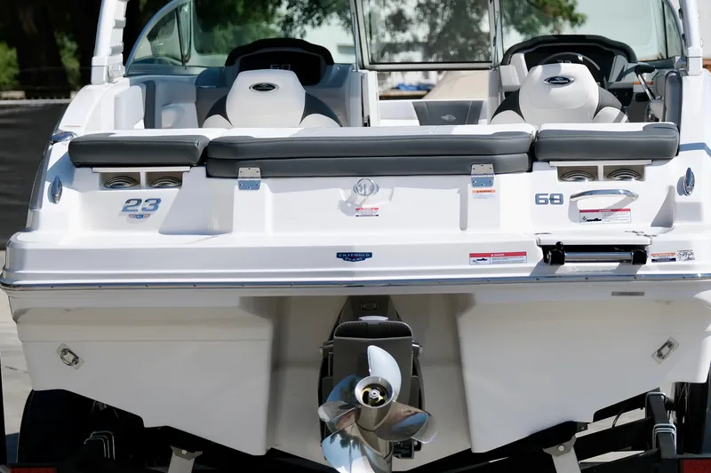 Slide: The Image of 2025 Chaparral 23 SSi boat, rear view with seating and propeller. - 4