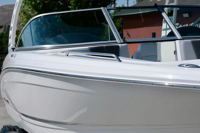 Slide: The Image of 2025 Chaparral 23 SSi boat with sleek white exterior and modern design. - 5