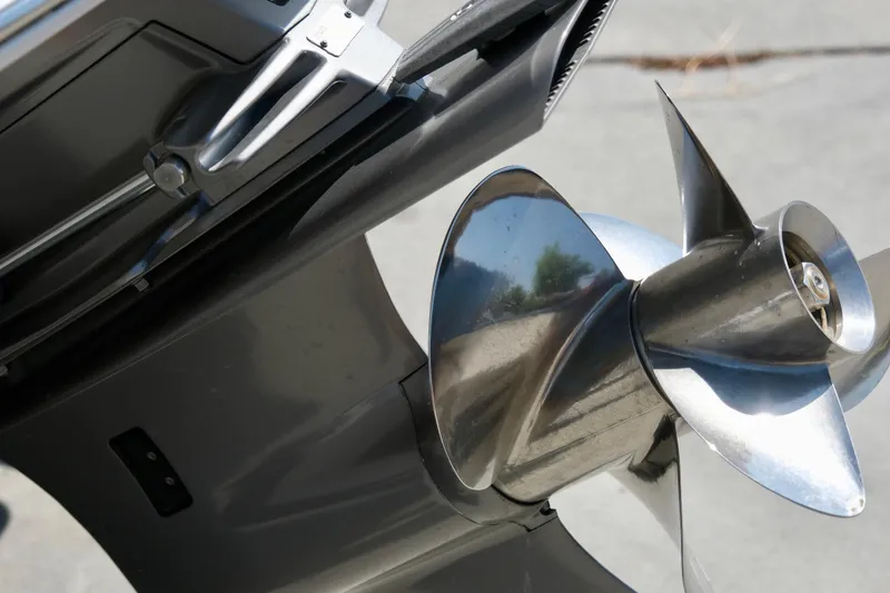 Slide: The Image of Close-up of a 2025 Chaparral 23 SSi boat propeller, showcasing its sleek metallic design. - 7