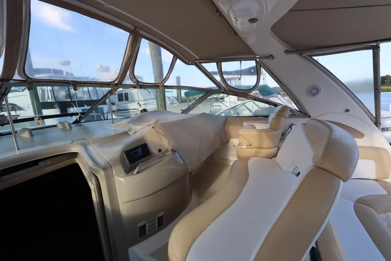 Slide: The Image of Interior view of 2000 Sea Ray 460 Sundancer yacht with beige seating and panoramic windows. - 20